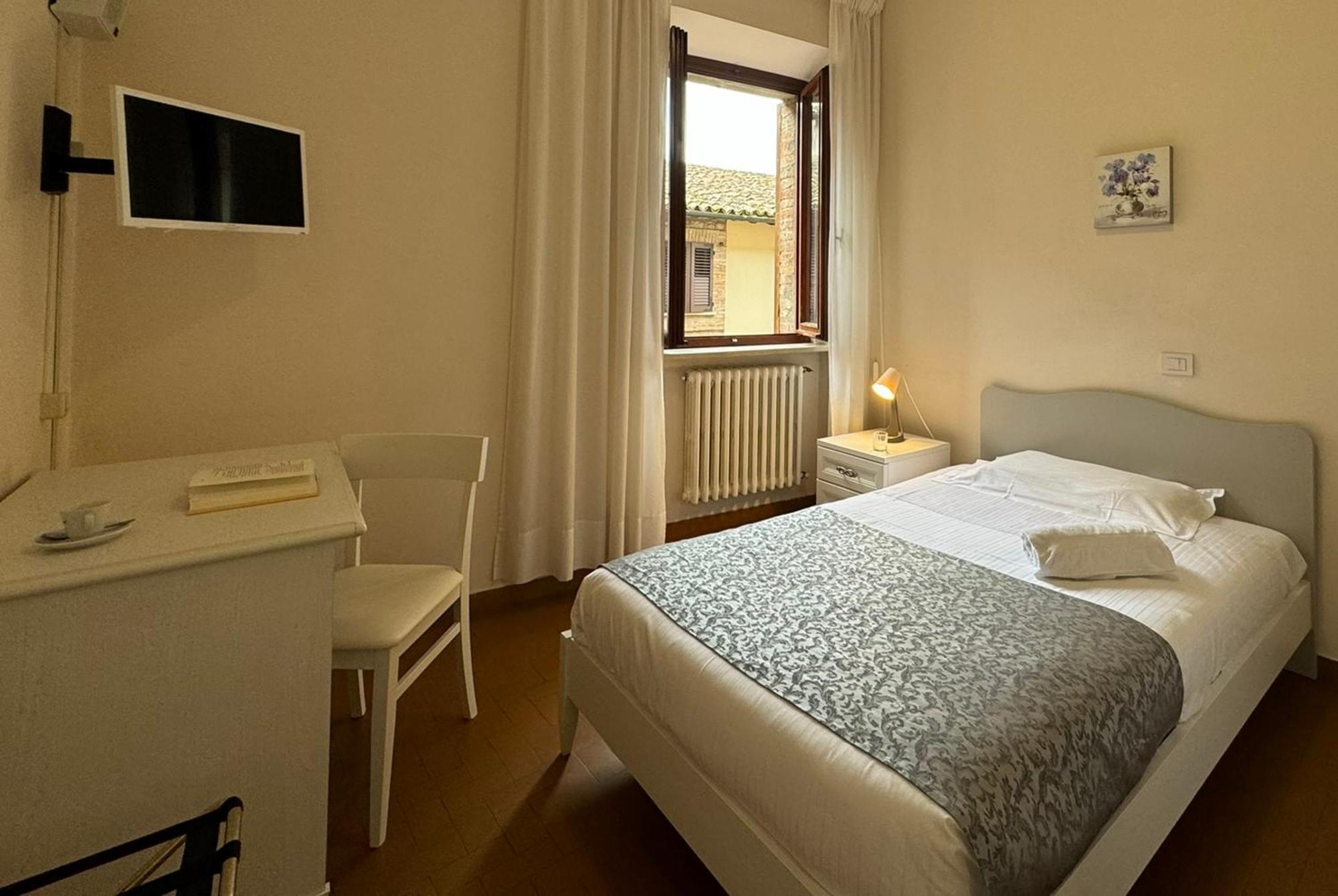 Monastero Ss. Annunziata Todi Exterior foto A room at the hotel